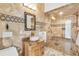 Elegant bathroom with a large walk-in shower, stone vanity, and modern fixtures at 5000 Palermo Dr, Punta Gorda, FL 33950