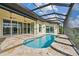Relaxing pool and patio area with covered lanai, perfect for entertaining at 5000 Palermo Dr, Punta Gorda, FL 33950