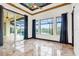 Bedroom with pool view and decorative ceiling at 5000 Palermo Dr, Punta Gorda, FL 33950