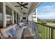 This spacious balcony features comfortable seating, an outdoor TV, and stunning views at 1425 Park Beach Cir # 127, Punta Gorda, FL 33950
