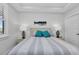 Well-lit bedroom featuring a whale-themed decor, complemented by shuttered windows and dark wood-look flooring at 1425 Park Beach Cir # 127, Punta Gorda, FL 33950