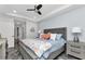 Well-lit bedroom with a modern ceiling fan, neutral color palette, stylish floors, and tasteful decor at 1425 Park Beach Cir # 127, Punta Gorda, FL 33950