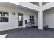 Inviting unit exterior with modern seating, a glass door, ample lighting, and contemporary design at 1425 Park Beach Cir # 127, Punta Gorda, FL 33950