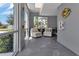 Bright lobby seating area with comfortable chairs and a view of tropical landscaping at 1425 Park Beach Cir # 127, Punta Gorda, FL 33950