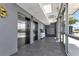 A modern lobby featuring elevators, mailboxes, and sleek tile flooring at 1425 Park Beach Cir # 127, Punta Gorda, FL 33950
