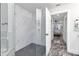 Modern bathroom with a glass-enclosed shower, a view into the bedroom, and marble accents at 1425 Park Beach Cir # 127, Punta Gorda, FL 33950