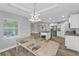 Open-concept kitchen featuring granite countertops, stainless steel appliances, and ample cabinet space at 14516 San Domingo Blvd, Port Charlotte, FL 33981
