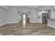 Open-concept living area with tile flooring connecting to kitchen, dining, and entryway at 14516 San Domingo Blvd, Port Charlotte, FL 33981