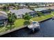 Aerial view of the property showcasing canal front location and pool at 431 Via Esplanade, Punta Gorda, FL 33950