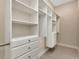 Walk-in closet with custom shelving and drawers for optimal storage at 5451 Prime Ter, North Port, FL 34286