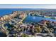 Aerial view of community with lake, tennis courts, and pool at 95 Vivante Blvd # 9542, Punta Gorda, FL 33950