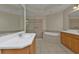 Bathroom features double vanity, soaking tub, and glass shower at 95 Vivante Blvd # 9542, Punta Gorda, FL 33950