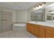 Spacious bathroom with soaking tub, shower, and double vanity at 95 Vivante Blvd # 9542, Punta Gorda, FL 33950