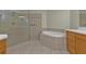 Bathroom features a large shower, garden tub, and updated vanity at 95 Vivante Blvd # 9542, Punta Gorda, FL 33950