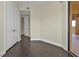 Bedroom with dark hardwood floors, neutral walls, and private access at 95 Vivante Blvd # 9542, Punta Gorda, FL 33950