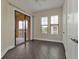 Bedroom with hardwood floors, neutral walls and private balcony access at 95 Vivante Blvd # 9542, Punta Gorda, FL 33950