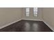 Bright bedroom with dark hardwood floors and neutral walls at 95 Vivante Blvd # 9542, Punta Gorda, FL 33950