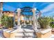 Community hot tub under gazebo with lush landscaping at 95 Vivante Blvd # 9542, Punta Gorda, FL 33950