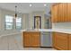 Kitchen features light wood cabinets, stainless steel appliances, and tile floors at 95 Vivante Blvd # 9542, Punta Gorda, FL 33950