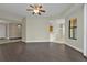 Spacious living area with dark hardwood floors and access to kitchen at 95 Vivante Blvd # 9542, Punta Gorda, FL 33950