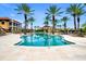 Resort-style pool surrounded by palm trees and lounge chairs at 95 Vivante Blvd # 9542, Punta Gorda, FL 33950