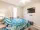 Bright bedroom with a queen bed, TV, and window coverings at 2002 Bal Harbor Blvd # 822, Punta Gorda, FL 33950