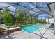 Enjoy this lovely screened pool and patio area at 10213 Beach Dune Dr, Englewood, FL 34223