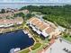 Aerial view of a canal-front community featuring multiple buildings and boat slips at 25188 Marion Ave # 1002, Punta Gorda, FL 33950