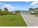 Two-car garage and well-maintained lawn at 14516 San Domingo Blvd, Port Charlotte, FL 33981