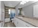 Clean bathroom, granite countertop, white cabinets, and a shower/tub combo at 14516 San Domingo Blvd, Port Charlotte, FL 33981