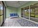 Relaxing screened porch with tiled floor and sliding glass doors at 14516 San Domingo Blvd, Port Charlotte, FL 33981