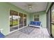 Relaxing screened porch with tiled floor and seating area at 14516 San Domingo Blvd, Port Charlotte, FL 33981