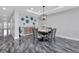 Elegant dining room with round table, four chairs, and marble flooring at 1425 Park Beach Cir # 127, Punta Gorda, FL 33950