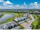 Aerial view of condo community near golf course and lake at 14050 Heritage Landing Blvd # 214, Punta Gorda, FL 33955