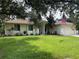 One-story house with a landscaped yard and attached garage at 4088 Felhorn St, Port Charlotte, FL 33948