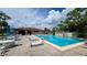 Refreshing community pool with lounge chairs at 23465 Harborview Rd # 645, Punta Gorda, FL 33980