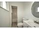 Updated bathroom, featuring a bathtub and marble-look tile at 1638 Harmony Dr, Port Charlotte, FL 33952