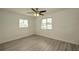 Bright bedroom with ceiling fan and wood-look flooring at 1638 Harmony Dr, Port Charlotte, FL 33952