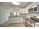 Modern kitchen with stainless steel appliances and granite countertops at 1638 Harmony Dr, Port Charlotte, FL 33952