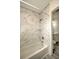Modern bathroom with marble-look tile and shower at 1638 Harmony Dr, Port Charlotte, FL 33952