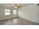 Bright bedroom with hardwood floors and ceiling fan at 1638 Harmony Dr, Port Charlotte, FL 33952
