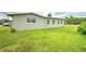 Spacious backyard with grassy lawn at 1638 Harmony Dr, Port Charlotte, FL 33952