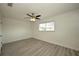 Spacious bedroom with ceiling fan and wood-look flooring at 1638 Harmony Dr, Port Charlotte, FL 33952