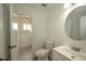 Bathroom with toilet, sink, and access to shower at 1638 Harmony Dr, Port Charlotte, FL 33952