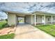 Covered carport and side view of house at 1638 Harmony Dr, Port Charlotte, FL 33952