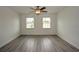 Spacious bedroom with hardwood floors and large windows at 1638 Harmony Dr, Port Charlotte, FL 33952