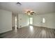 Living room with hardwood floors, ceiling fan and entry view at 1638 Harmony Dr, Port Charlotte, FL 33952