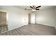 Bedroom with access to bathroom and ceiling fan at 1638 Harmony Dr, Port Charlotte, FL 33952