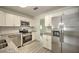 Modern kitchen with stainless steel appliances and granite countertops at 1638 Harmony Dr, Port Charlotte, FL 33952