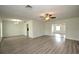Bright living room with hardwood floors and ceiling fan at 1638 Harmony Dr, Port Charlotte, FL 33952